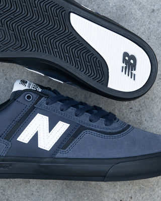 New Balance Numeric Jamie Foy 306 Shoes in Eclipse/White - low-profile vulcanized skate shoe with lightweight suede, breathable mesh panels, and visible rubber layer