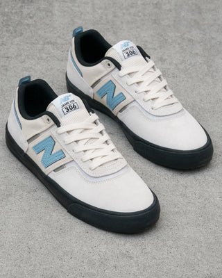 New Balance Numeric Jamie Foy 306 skate shoes in White and Blue with durable suede and mesh upper, rubber underlays, vulcanized outsole, elastic gusseted tongue, and hidden toe protection