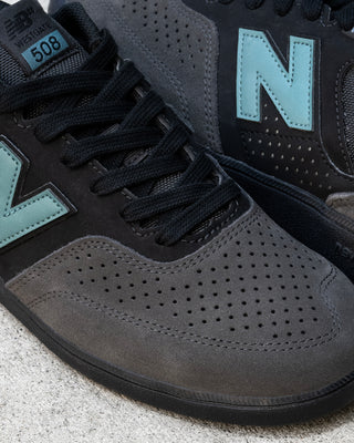 New Balance Numeric 508 Brandon Westgate skate shoe in dark grey and teal with suede toe, mesh collar, reflective details.