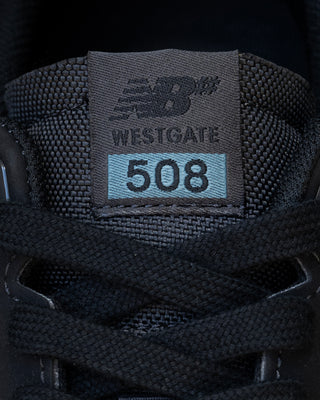 New Balance Numeric 508 Brandon Westgate skate shoe in dark grey and teal with suede toe, mesh collar, reflective details.