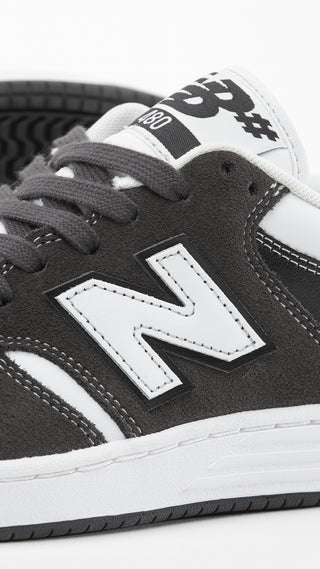 New Balance Numeric 480 in Black Cement/White with suede mesh upper, FuelCell foam, and reinforced toe cap.