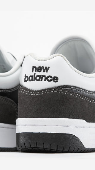 New Balance Numeric 480 in Black Cement/White with suede mesh upper, FuelCell foam, and reinforced toe cap.
