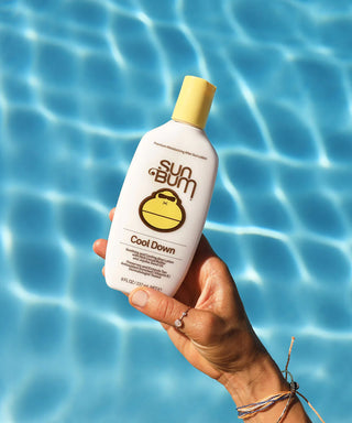 Image of Sun Bum's 'Cool Down' Lotion, a nourishing after-sun lotion enriched with soothing Aloe and Vitamin E for rehydrating and revitalizing sun-exposed skin.