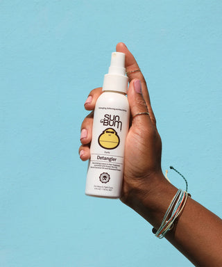 Image of Sun Bum's Curls Detangler, a nourishing spray designed to smooth and condition curly hair while protecting it from damaging UV rays.