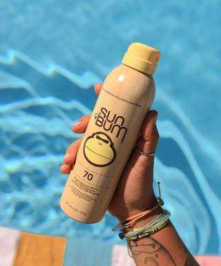 Image of Sun Bum Original SPF 70 Sunscreen Spray, a high-protection, vegan, and reef-safe sunscreen, infused with Vitamin E and offering 80 minutes of water resistance.