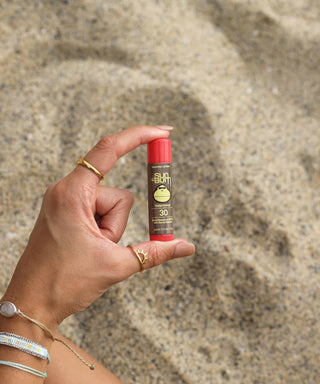 Picture of Sun Bum's SPF 30 Sunscreen Lip Balm - Watermelon, fortified with Aloe and Vitamin E for moisturizing and sun protection.