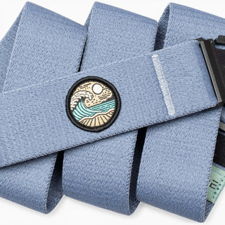 Arcade Belts Save The Waves Belt in Sky — A2 buckle, micro-adjustable REPREVE® stretch webbing, metal-free, original Erik Abel artwork, 10% to wave conservation

