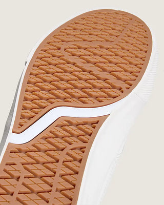 Close-up of a brown sole with tread pattern on a white background