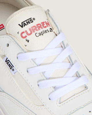 White Vans sneaker with 'Curren Caples' branding on a white background