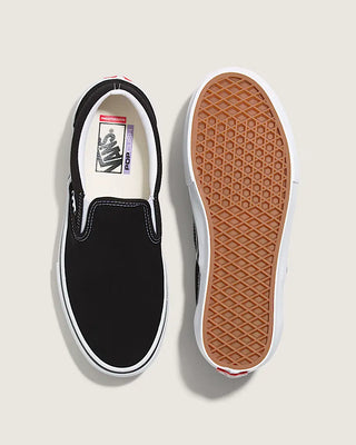 Black slip-on sneaker with white sole on a light gray background