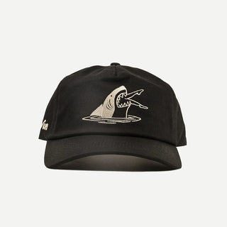 Black Duvin hat with embroidered shark graphic and curved brim.
