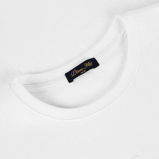 White Dime t-shirt with small cursive embroidered logo on chest and classic short sleeve silhouette.
