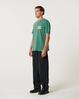 Critical Slide Sabbatical Tee in Dusty Green with artist collaboration print and garment-dyed soft cotton finish.