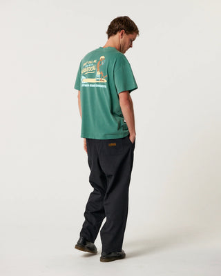 Critical Slide Sabbatical Tee in Dusty Green with artist collaboration print and garment-dyed soft cotton finish.