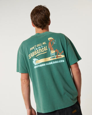 Critical Slide Sabbatical Tee in Dusty Green with artist collaboration print and garment-dyed soft cotton finish.
