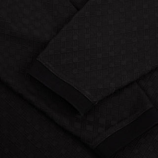 Dime Jacquard Long Sleeve Polo in Black — 100% polyester with pearl button placket, ribbed striped collar, ribbed cuffs, set-in sleeves, and embroidered Dime logo at left chest