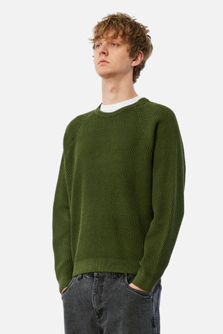 Pine green Dime wave knit sweater with textured wave pattern.