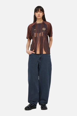 Bronze Dime team jersey with woodgrain pattern, gradient striping, and raglan sleeve athletic silhouette.
