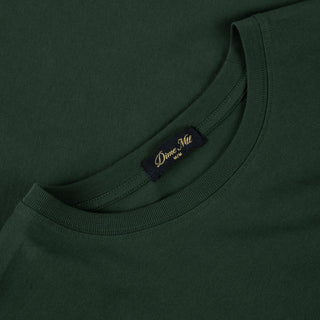 Front view of Dime Classic Big Logo Long Sleeve Tee in Mountain Green with a light-colored Dime logo printed across the chest