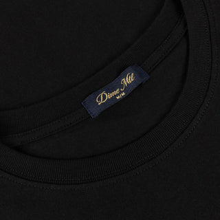 Black Dime tee with small cursive logo on chest.