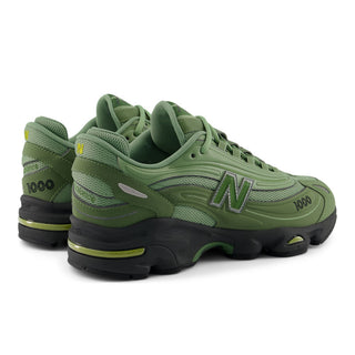 New Balance 1000 sneakers in Utility Green and Oregano colorway with inverted mesh underlays and suede overlays