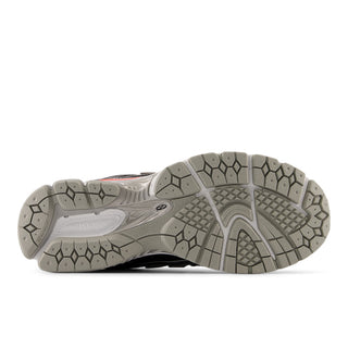 New Balance 1906R lifestyle sneaker in black metallic and urgent red with heel pods, cushioned midsole, and arched overlays.