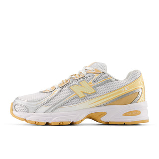 New Balance 740 in white/indoor court with mesh upper, ABZORB cushioning, and reflective detailing.