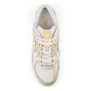 New Balance 740 in white/indoor court with mesh upper, ABZORB cushioning, and reflective detailing.