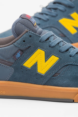 New Balance Numeric Jamie Foy 306 Cup in Shadow Blue/Mars Yellow — Jamie Foy signature cupsole skate shoe with suede and mesh upper, hidden toe protection, molded EVA insole, and gum rubber outsole