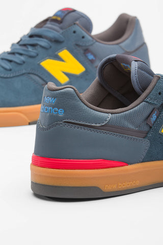 New Balance Numeric Jamie Foy 306 Cup in Shadow Blue/Mars Yellow — Jamie Foy signature cupsole skate shoe with suede and mesh upper, hidden toe protection, molded EVA insole, and gum rubber outsole