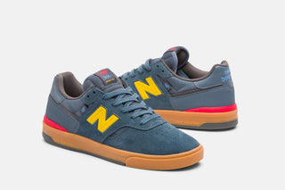 New Balance Numeric Jamie Foy 306 Cup in Shadow Blue/Mars Yellow — Jamie Foy signature cupsole skate shoe with suede and mesh upper, hidden toe protection, molded EVA insole, and gum rubber outsole