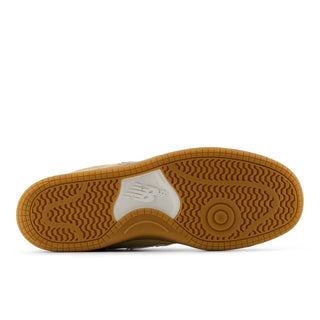 Brown sole of a shoe with a white logo on a white background