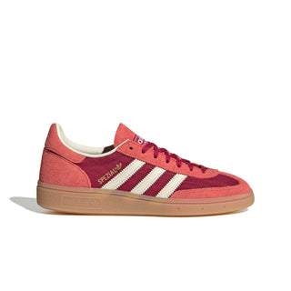 adidas Originals Handball Spezial in Team Victory Red/Off White/Preloved Scarlet — soft suede and textile upper with rubber outsole, lace closure, and Trefoil tongue logo celebrating the iconic 1979 heritage.

