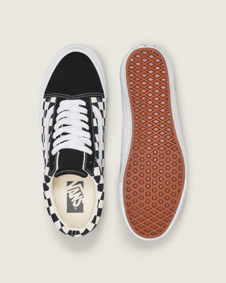 Black and white Vans Old Skool shoes with checkerboard canvas, suede overlays, white Sidestripe, and white rubber outsole.