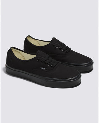 Vans Authentic Shoe in Black/Black, featuring a low-top, lace-up design, sturdy canvas uppers, and signature waffle outsoles.