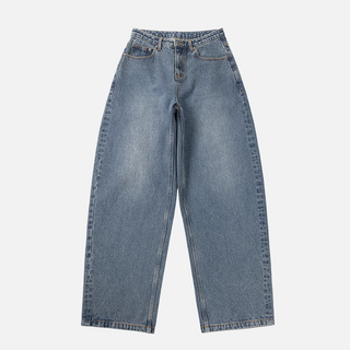 Front view of Dime Women’s Baggy Denim Pants in Indigo Washed with faded blue denim, wide legs, curved front pockets, and belt loops