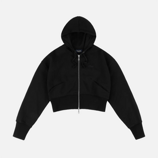 Model wearing the Dime Cropped Zip Hoodie in Black with a silver-tone front zipper, dropped shoulders, and ribbed cuffs