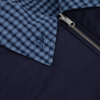 Front view of Dime Reversible Bomber Jacket in Navy with a blue plaid collar, full-length zipper, raglan sleeves, and gathered cuffs and hem