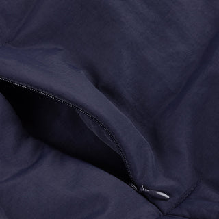 Front view of Dime Reversible Bomber Jacket in Navy with a blue plaid collar, full-length zipper, raglan sleeves, and gathered cuffs and hem