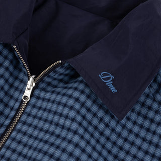 Front view of Dime Reversible Bomber Jacket in Navy with a blue plaid collar, full-length zipper, raglan sleeves, and gathered cuffs and hem