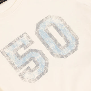Front view of Dime Women’s Team Tee in Off-White with a large pale number 50 graphic across the chest and a small label near the hem