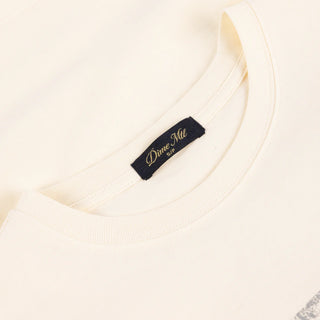 Front view of Dime Women’s Team Tee in Off-White with a large pale number 50 graphic across the chest and a small label near the hem