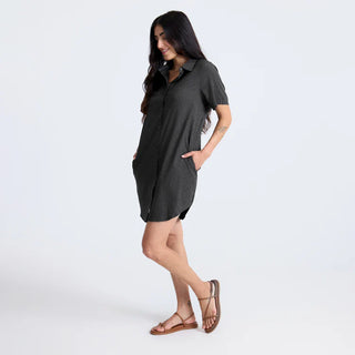 Roark Women's Bless Up Dress in Black, relaxed fit technical perforated shirt dress in 68% nylon 32% polyester with moisture-wicking quick-dry fabric, rubberized buttons, magnetic pocket closure, and leopard printed lining