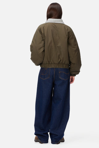 Front view of Dime Reversible Bomber Jacket in Olive with a contrasting plaid collar, full-length zipper, raglan sleeves, and gathered cuffs and hem
