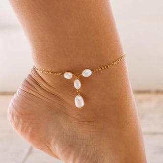 Gold anklet with pearl-inspired beads and delicate chain.