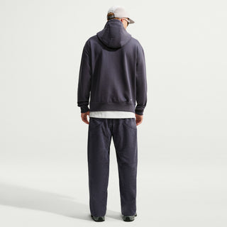 Rear view of the Nike ACG Tuff Fleece Pullover Hoodie in Gridiron/Summit White, showing the hood and small white Swoosh near the hem.