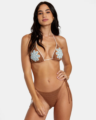 Woman sporting the RVCA Cotton Crochet Halter Triangle Bikini Top, featuring a woven floral design, skinny ties at the neck and back, and skimpy coverage.