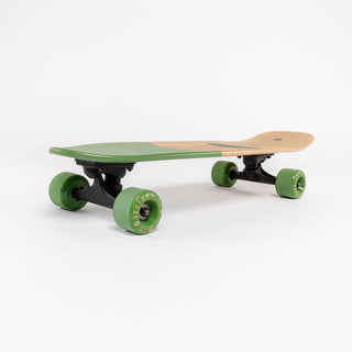 “Sector 9 Bambino Bivy complete skateboard with natural bamboo finish, green nose and wheels, black trucks, and beach camping badge artwork.”