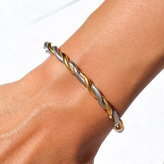 Mixed-metal open cuff bracelet with polished finish.
