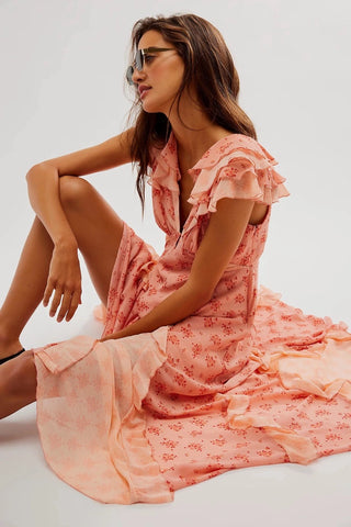 Floral Free People Joaquin Dress with V-neckline, ruffled details, and flowy silhouette.